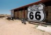 Image of a motorbike by the Route 66 sign as part of a Route 66 tours planning guide