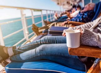 Image of a senior woman relaxing on the deck of a ship as part of a single cruises holiday