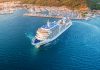 Image of a cruise ship pulling to harbour from the air and typical of the kind of cheap cruises - such as cheap cruises from Southampton - if you know where to look