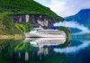 Image of a cruise ship on Geiranger fjord, Norway, typical of a last minute cruise deals bargain holiday