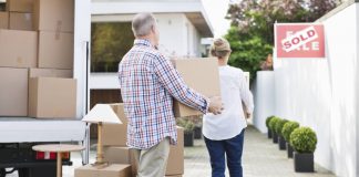 Image of a senior couple moving home using removal companies for removal and storage