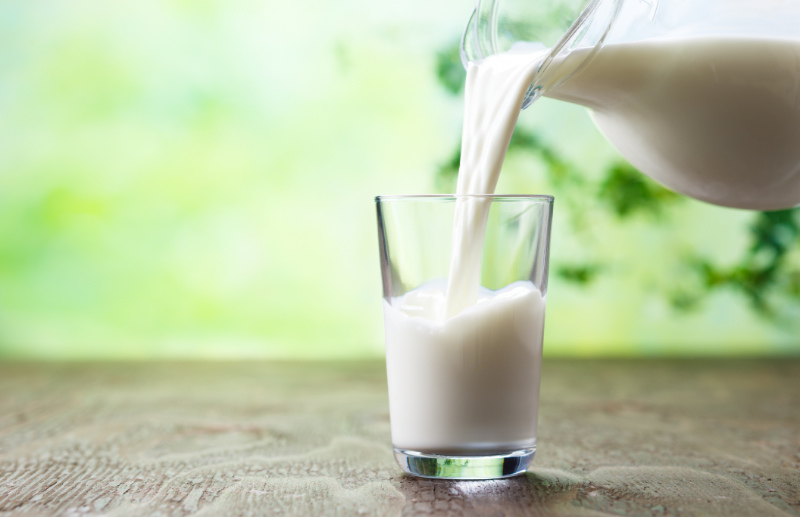 Pouring milk in the glass – try drinking milk to help you get a good night's sleep