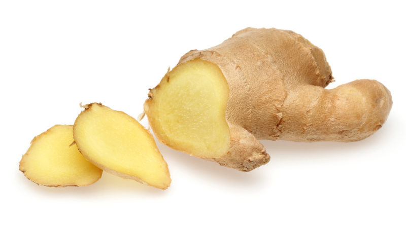 Winter wellness tips Whole and sliced ginger root in isolated white background