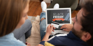Black Friday survival guide – promotion sale on laptop screen.