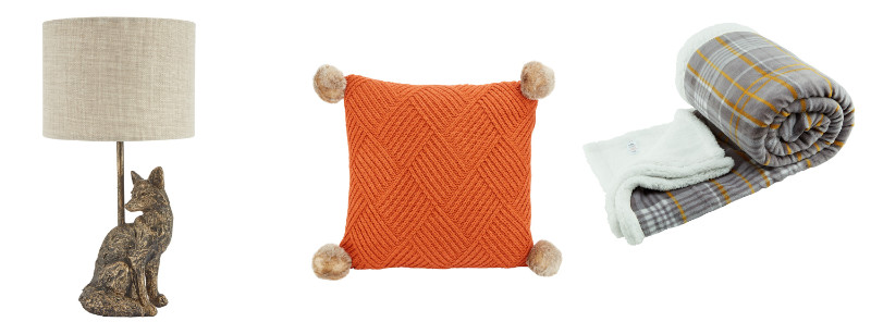 (L-R) Morrisons Ochre Birdy Fox Table Lamp, £17; Morrisons Century Studio Orange Knit Cushion, !2; Morrisons Ochre Birdy Country Check Throw, £18 (Morrisons/PA)