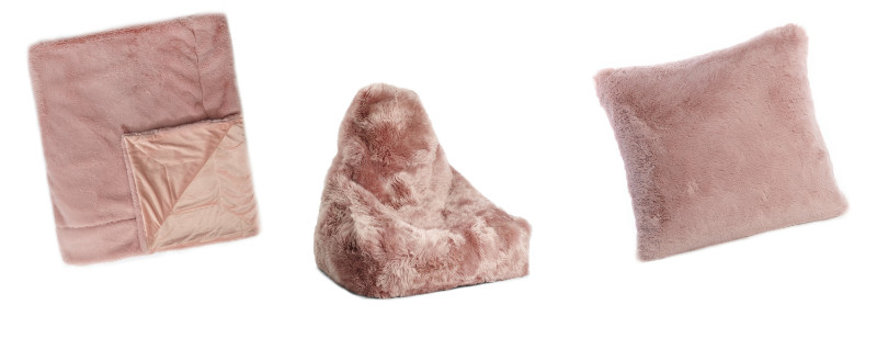 Cosy winter home: pink furry throws and cushions