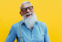 Image of a senior man against a yellow background to illustrate how to live well for longer