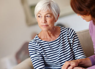 Reduce dementia risk Shot of a woman sitting beside her elderly mother