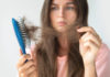Stress and hair loss woman upset at hair loss