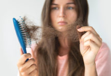Stress and hair loss woman upset at hair loss