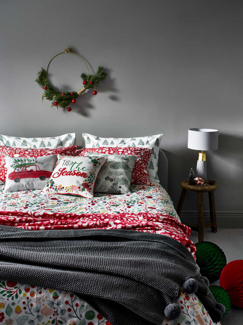 Foliage Easy Care Duvet Set, from £10; Green Pine Leaves Cushion, £6, George Home/Asda (George Home/PA)