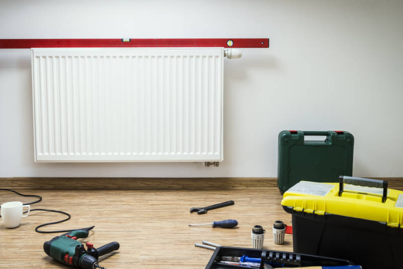 Measuring carefully is the secret for how to hang a radiator.
