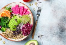 Healthy food weight loss Vegan, detox Buddha bowl with quinoa, micro greens, avocado, blood orange, broccoli, watermelon radish, alfalfa seed sprouts.