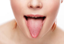 A generic photo of a woman showing her tongue.