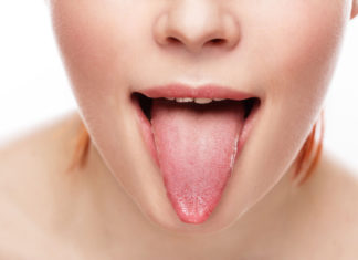 A generic photo of a woman showing her tongue.