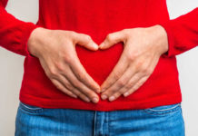 Generic photo of woman holding her hands in shape of a heart on her stomach (Thinkstock/PA)