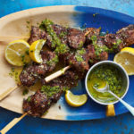Poppy and coconut beef kebabs from Ainsley’s Caribbean Kitchen by Ainsley Harriott (Ebury/Dan Jones/PA)