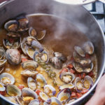Clams and chorizo from ANDALUSIA: Recipes from Seville and beyond by Jose Pizarro (Emma Lee/PA)