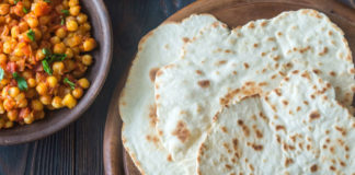 Bowl of chana masala with flatbread