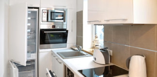 How to make a small kitchen look bigger Small whitewashed kitchen