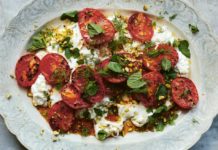 Chilli-roast tomatoes with feta - From the Oven to the Table: Simple dishes that look after themselves by Diana Henry (Mitchell Beazley/Laura Edwards/PA)
