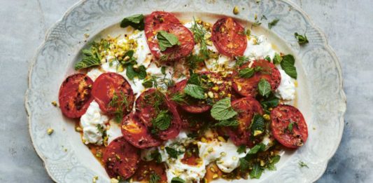 Chilli-roast tomatoes with feta - From the Oven to the Table: Simple dishes that look after themselves by Diana Henry (Mitchell Beazley/Laura Edwards/PA)