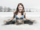 Wim Hof method Young lady bathing in the ice hole