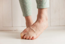 Generic photo of a woman with bare feet curling her toes in order to hide them (Thinkstock/PA)
