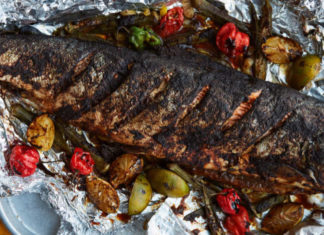 Preheat the oven to 160°C Fan/180°C/Gas 4. Place the fish parcel on a baking tray and bake for 50 minutes to an hour until the fish is cooked through.