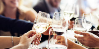 People clinking their wine glasses together (ThinkStock/PA)