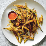 okra fries from Dishoom by Shamil Thakrar, Kavi Thakrar and Naved Nasir (Bloomsbury, £26) (Bloomsbury/Haarala Hamilton/PA)