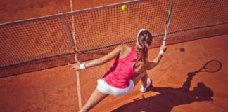 Health benefits of tennis Female tennis player hitting a ball with forehand volley