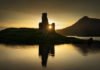 UK Beauty spots: Ardvreck Castle reflections on Loch Assynt in sunset light, Scotland