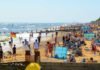 Southwold, UK – August 17, 2016 – People sunbathing and playing at Southwold beach.