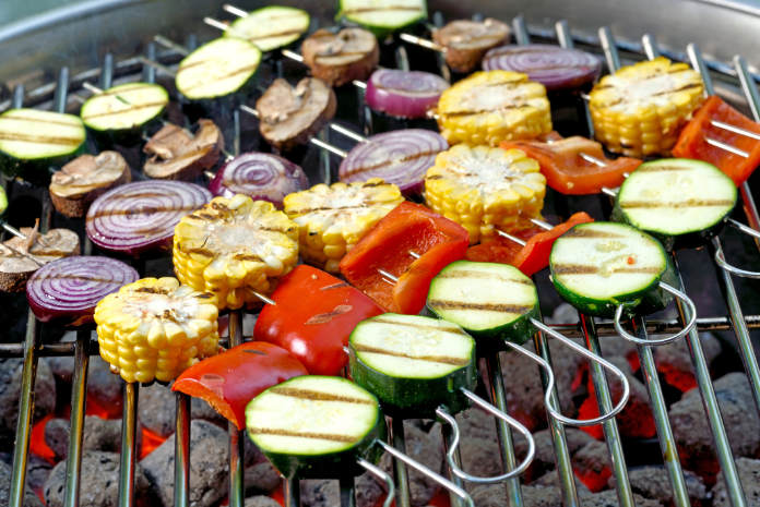 Mixed vegetable skewers on a hot barbecue