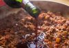 Best white and red wine to cook with Red wine being poured into ground beef dish