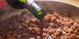 Best white and red wine to cook with Red wine being poured into ground beef dish