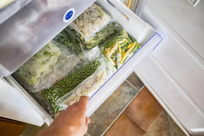Freezer Drawer With Packed Vegetables.