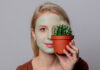 Cactus beauty products beautiful blond girl with green mask and cactus
