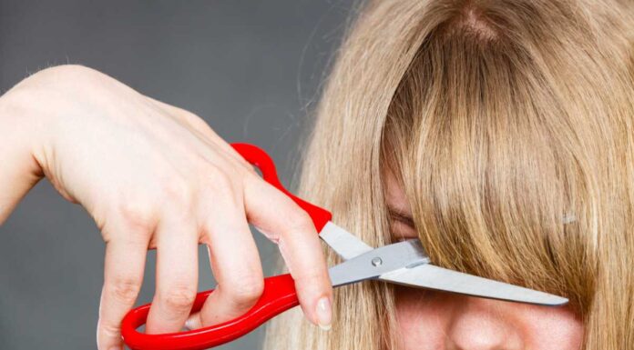 Hair mistakes – Woman cutting her fringe
