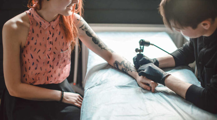 A tattoo artist creating a tattoo