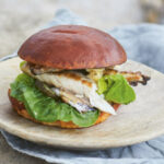 Fried mackerel, with horseradish butter, gherkins and lettuce in brioche buns