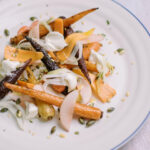 Roasted carrots recipe with spiced pumpkin seeds, peaches and crème fraîche