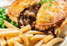 Food cravings for Homemade beef stew pie with french fries. Meat in puff pastry