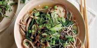 Miso noodle soup with mushrooms, peas and greens