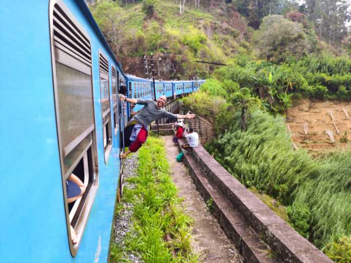 Tourists travelling on a train in Sri Lanka 