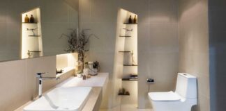 Installing a new bathroom – Modern interior of twin bathroom with sinks and toilet at home.