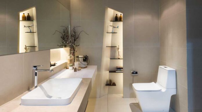 Installing a new bathroom – Modern interior of twin bathroom with sinks and toilet at home.