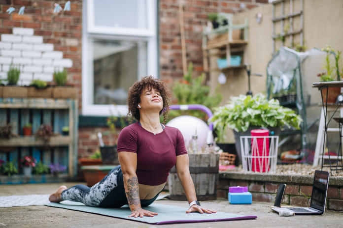 Why do yoga mental health wellbeing - posing woman