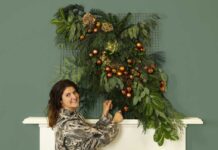 Dobbies’ stylist Rebecca Stanton with a festive floral tapestry